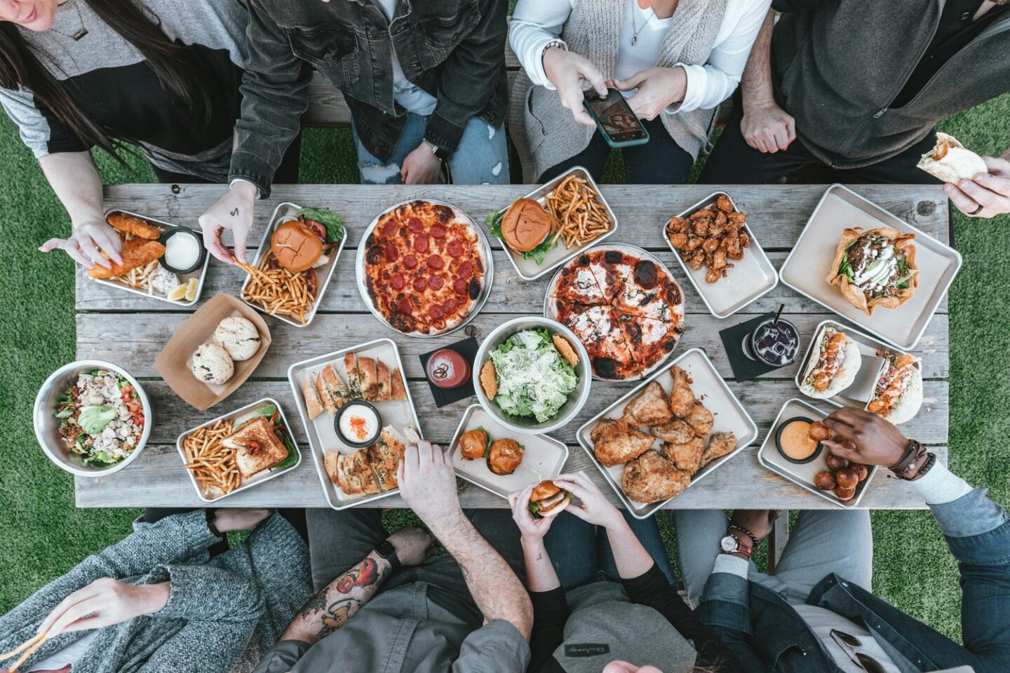 table of food being shared by friends | Kindful Body | Online Eating Disorder Therapists and Nutrition Counselors | San Francisco, CA 94115 and San Carlos, CA 94070