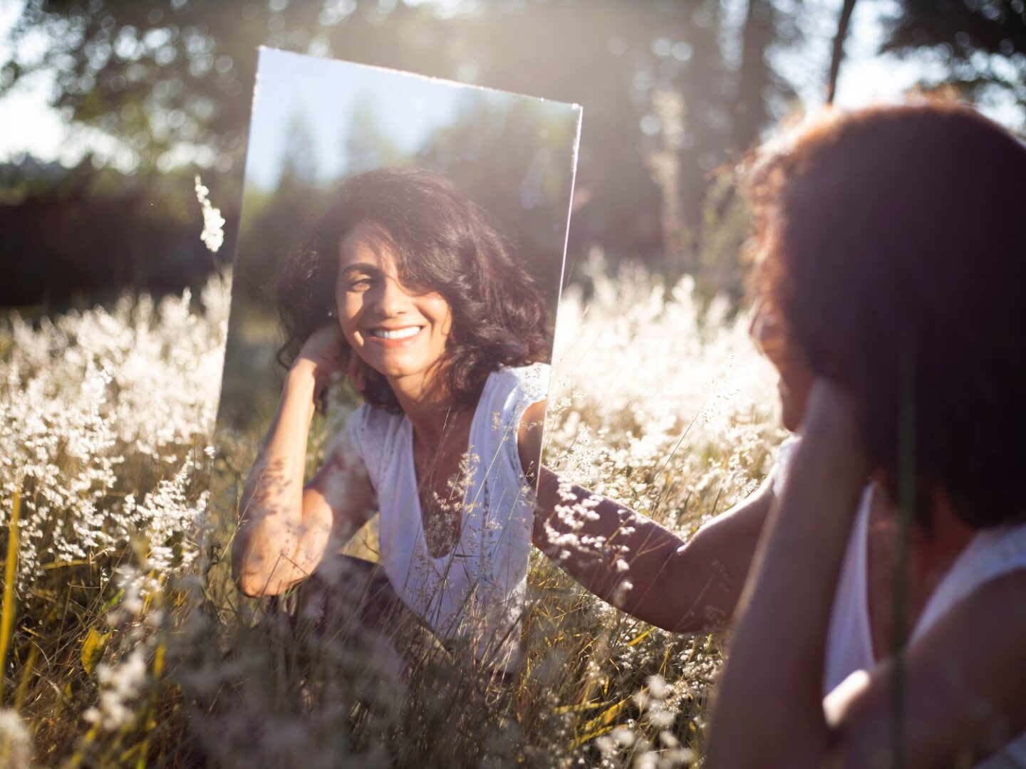 woman smiling in mirror | Pasadena CA eating disorder treatment 91101 91103 91104 91105 91106 91107 91108 91109 91110 91114 91115 91116 91117 91118 91121 91123 91124 91125 91126 91129 91182 91184 91185 91186 91187 91188 91189